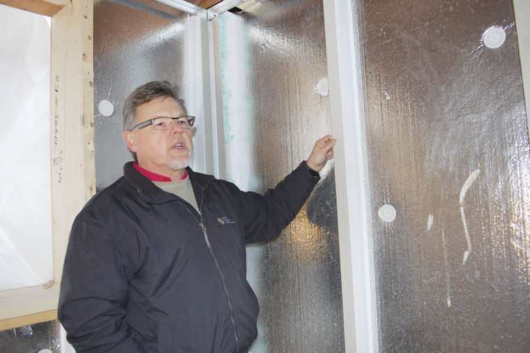 Gord Turner checks out the Quik-Therm Concrete Insulation System in the basement that snaps together like Lego.
